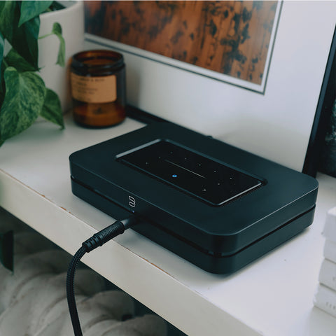 Node Black (2024 Version), on credenza with headphones plugged in