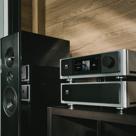 NAD M66 stacked on NAD M23 beside PSB Synchrony