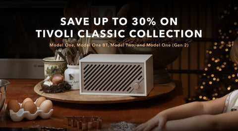 Tivoli Model Two radio on a table with with christmas and holiday decorations. save up to 30% on tivoli classic collection. Model One, Model One BT, Model Two, and Model One (Gen 2)