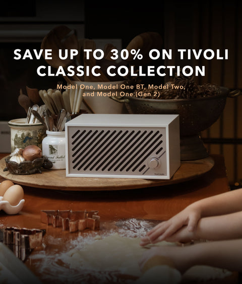 Tivoli Model Two radio on a table with with christmas and holiday decorations. save up to 30% on tivoli classic collection. Model One, Model One BT, Model Two, and Model One (Gen 2)